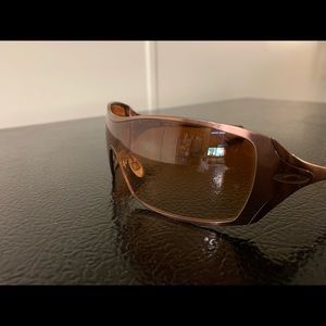 Oakley Dart Sunglasses In rose gold.